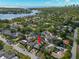 Expansive aerial view of neighborhood featuring lush greenery, water access, and clear view of the home's location at 230 32Nd N Ave, St Petersburg, FL 33704