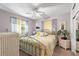 Inviting bedroom with comfortable bed, ceiling fan, ample natural light, and tasteful decor throughout at 230 32Nd N Ave, St Petersburg, FL 33704