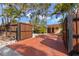 Home exterior with a long driveway lined with tropical trees and shrubs at 230 32Nd N Ave, St Petersburg, FL 33704