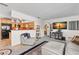 Open-concept living space featuring comfortable seating, modern decor, and seamless flow into the adjacent kitchen at 230 32Nd N Ave, St Petersburg, FL 33704