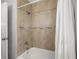Bathroom featuring a tub with tile surround and a shower curtain at 2511 W Braddock St, Tampa, FL 33607