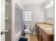 Bathroom with granite vanity, toilet and shower at 2511 W Braddock St, Tampa, FL 33607