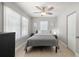 Cozy bedroom with neutral decor, a ceiling fan, and bright natural light at 2511 W Braddock St, Tampa, FL 33607
