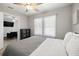 Nicely styled bedroom with a gray accent wall and ceiling fan at 2511 W Braddock St, Tampa, FL 33607