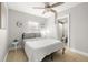 Cozy bedroom with natural light, ceiling fan and adjacent bathroom access at 2511 W Braddock St, Tampa, FL 33607