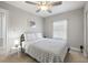 Well-lit bedroom offers a ceiling fan, neutral decor, and a comfortable atmosphere at 2511 W Braddock St, Tampa, FL 33607