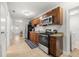 Spacious kitchen with granite counters, wood cabinets, and stainless steel appliances at 2511 W Braddock St, Tampa, FL 33607