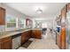 Bright kitchen with granite counters, stainless appliances, and a view to the living area at 2511 W Braddock St, Tampa, FL 33607