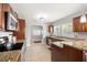 Bright kitchen with granite countertops, stainless appliances, and ample cabinet space at 2511 W Braddock St, Tampa, FL 33607