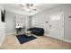 Inviting living room featuring tile floors, ceiling fan, and a comfortable seating area at 2511 W Braddock St, Tampa, FL 33607