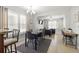 Open-concept living and dining area with neutral decor and lots of light at 2511 W Braddock St, Tampa, FL 33607