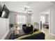 Cozy living room with natural light, ceiling fan, and neutral decor at 2511 W Braddock St, Tampa, FL 33607