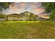 Expansive backyard with a covered patio, perfect for outdoor entertaining at 26249 Sword Dancer Dr, Wesley Chapel, FL 33544