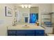Bathroom vanity with a large mirror and nautical themed decor at 26249 Sword Dancer Dr, Wesley Chapel, FL 33544