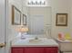Bathroom with vanity, mirror, framed artwork, and decorated with lighthouse figurines at 26249 Sword Dancer Dr, Wesley Chapel, FL 33544