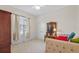 Bedroom with carpet, a window, and light walls at 26249 Sword Dancer Dr, Wesley Chapel, FL 33544