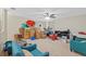 Large room with ceiling fan, carpet, and boxes at 26249 Sword Dancer Dr, Wesley Chapel, FL 33544