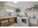 Functional laundry room with washer, dryer, utility sink, and built-in counter at 26249 Sword Dancer Dr, Wesley Chapel, FL 33544