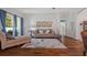 Bright living room with hardwood floors and access to the outside patio at 26249 Sword Dancer Dr, Wesley Chapel, FL 33544
