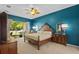 Spacious main bedroom featuring an ornate bed, private outdoor access, and natural light at 26249 Sword Dancer Dr, Wesley Chapel, FL 33544