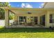 Covered patio with ceiling fan, outdoor furniture, and view of backyard at 26249 Sword Dancer Dr, Wesley Chapel, FL 33544