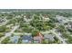 An aerial perspective of this property highlights its proximity to essential amenities and serene, tree-lined streets at 2664 Frisco Dr, Clearwater, FL 33761