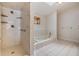The bathroom features a separate shower and soaking tub with a skylight overhead at 2664 Frisco Dr, Clearwater, FL 33761