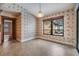 Bright breakfast nook features neutral tile flooring and sliding glass doors offering relaxing pool views at 2664 Frisco Dr, Clearwater, FL 33761