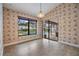 Bright dining area with sliding glass doors leading to the pool, perfect for entertaining at 2664 Frisco Dr, Clearwater, FL 33761