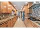 A modern kitchen showcasing stainless appliances, granite countertops, and ample storage at 2664 Frisco Dr, Clearwater, FL 33761