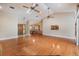 Spacious living room with hardwood floors and high ceilings, leading to the dining area and kitchen at 2664 Frisco Dr, Clearwater, FL 33761
