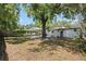 Spacious backyard featuring a large tree providing ample shade and privacy, great for outdoor activities and relaxation at 2821 Marconi St, Tampa, FL 33605