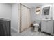 Updated bathroom with a floral shower curtain and modern fixtures at 2821 Marconi St, Tampa, FL 33605