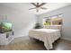 Neutral bedroom featuring a ceiling fan, tv, and natural light at 2821 Marconi St, Tampa, FL 33605