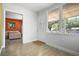 Bright foyer with a stylish front door, tile floors, and a view into the cozy living room at 2821 Marconi St, Tampa, FL 33605