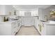 Bright kitchen featuring white cabinetry, stainless steel appliances, and quartz countertops at 2821 Marconi St, Tampa, FL 33605