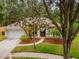 Charming single-story home featuring a well-manicured lawn and a two car garage at 3728 Cypress Meadows Rd, Tampa, FL 33624