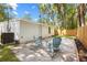 Backyard featuring seating, white siding, a new fence, and an external AC unit at 37401 Magnolia Ave, Dade City, FL 33523