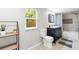 Bathroom with a granite vanity, dark wood cabinets, and a shower and tub combination with a patterned backsplash at 37401 Magnolia Ave, Dade City, FL 33523