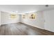 Bright living room with hardwood floors, fresh paint, and several well-placed windows at 37401 Magnolia Ave, Dade City, FL 33523