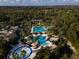 Aerial view of the community amenities showcasing the pools, tennis courts, and splash pad at 3844 Silverlake Way, Wesley Chapel, FL 33544