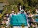 Aerial view of the community pool with water slide and lounge area, perfect for Gathering fun and relaxation at 3844 Silverlake Way, Wesley Chapel, FL 33544