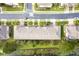 Aerial view of townhomes with lush landscaping, and well-maintained streets, offering a serene and upscale community at 3844 Silverlake Way, Wesley Chapel, FL 33544