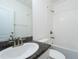 Bathroom featuring granite countertops, a bathtub, and modern fixtures at 3844 Silverlake Way, Wesley Chapel, FL 33544