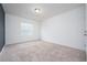 Neutral bedroom with carpet floors, light walls, and a window providing natural light at 3844 Silverlake Way, Wesley Chapel, FL 33544