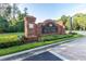 Elegant brick sign for The Club at Seven Oaks, surrounded by manicured landscaping, offering a welcoming entrance at 3844 Silverlake Way, Wesley Chapel, FL 33544