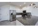 Well-equipped kitchen with stainless steel appliances and granite countertops at 3844 Silverlake Way, Wesley Chapel, FL 33544