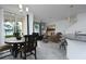 Open-concept space with a dining area and living room featuring stylish decor and ample natural light at 3844 Silverlake Way, Wesley Chapel, FL 33544