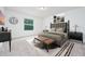 Serene main bedroom boasts neutral tones and comfortable furnishings at 3844 Silverlake Way, Wesley Chapel, FL 33544