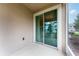 Enclosed patio offers a relaxing outdoor space with sliding glass doors at 3844 Silverlake Way, Wesley Chapel, FL 33544